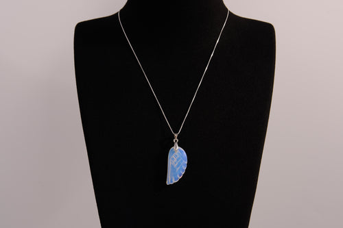 Raw Earth Crystals opalite angel wing pendant, featuring a delicate blue opalite stone carved into an elegant wing shape and set on a silver-tone chain, promoting calmness, spiritual connection, and emotional healing.