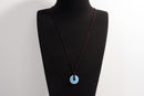 Raw Earth Crystals opalite disc pendant necklace made with natural crystal for emotional healing, clarity, and spiritual connection.