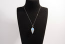 Raw Earth Crystals opalite pendant with a spiral wire wrap design, crafted from natural stone to promote emotional balance, calmness, and inner peace.