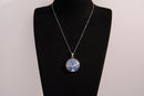 Raw Earth Crystals opalite pendant featuring a tree of life design, crafted with natural crystal for emotional healing, calmness, and spiritual growth.