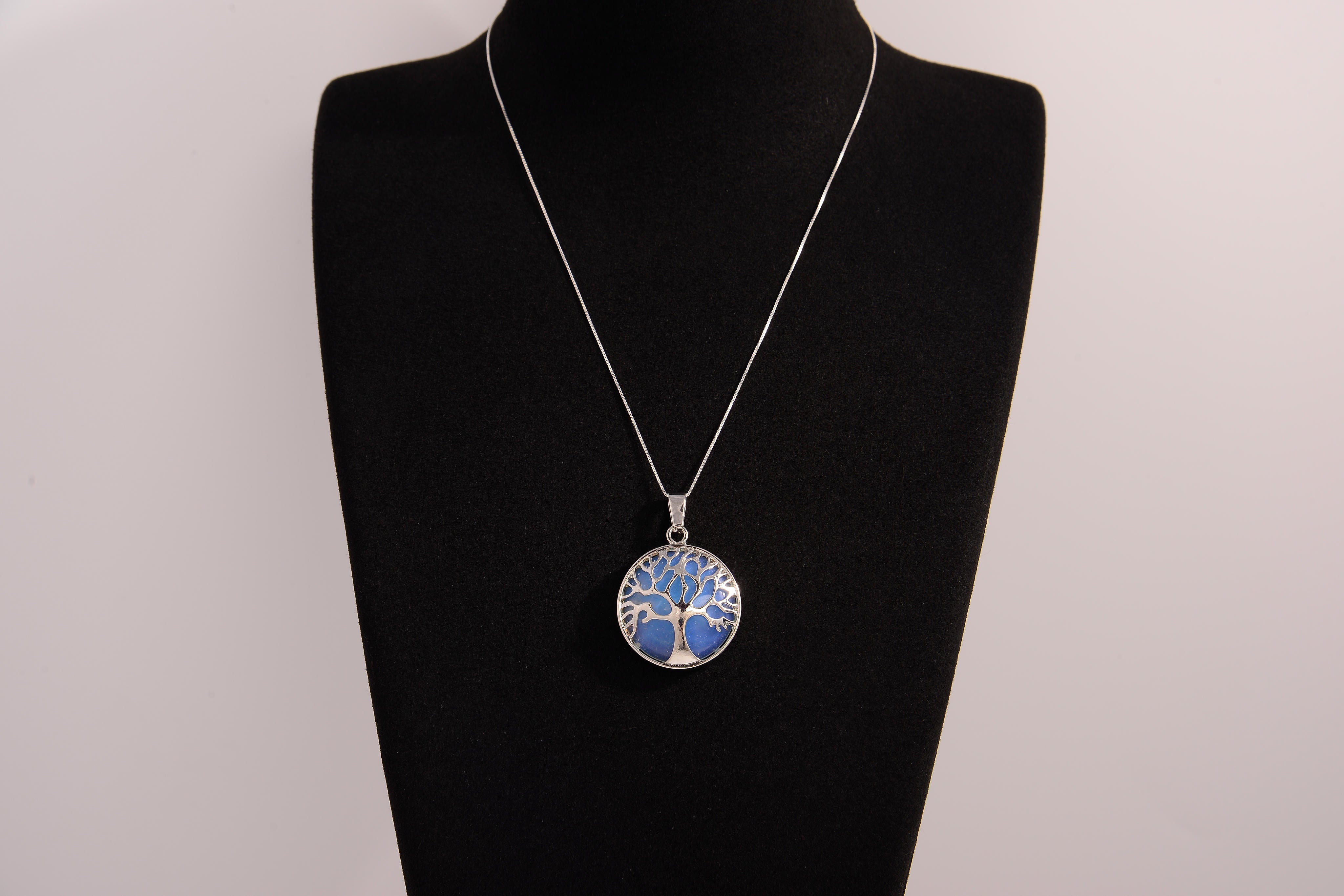 Raw Earth Crystals opalite pendant featuring a tree of life design, crafted with natural crystal for emotional healing, calmness, and spiritual growth.