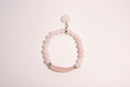Raw Earth Crystals pink rose quartz bracelet with raw stone accent, crafted from natural crystal, promotes love, compassion, and emotional healing.