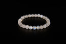 Rainbow moonstone beaded bracelet from Raw Earth Crystals, featuring natural gemstones with iridescent glow for intuition, emotional healing, and spiritual clarity.