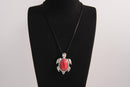 Raw Earth Crystals red howlite turtle necklace crafted from natural stone to support calm focus, stress relief, and emotional grounding.