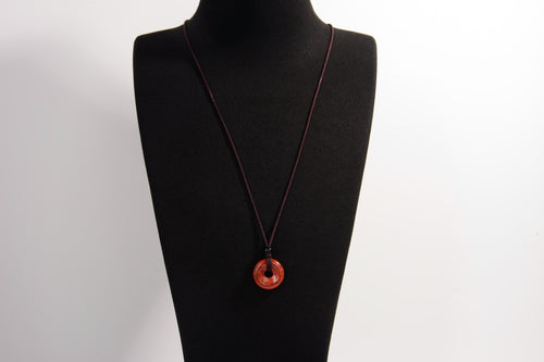 Raw Earth Crystals red jasper disc pendant necklace crafted from natural crystal for strength, grounding, and vitality.