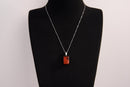 Raw Earth Crystals red jasper rectangle pendant necklace featuring natural crystal jewelry designed for grounding, strength, and emotional stability.
