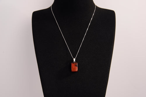 Raw Earth Crystals red jasper rectangle pendant necklace featuring natural crystal jewelry designed for grounding, strength, and emotional stability.