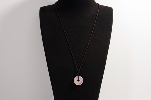 Raw Earth Crystals rose quartz disc pendant necklace crafted from natural crystal for love, compassion, and emotional healing.