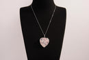 Raw Earth Crystals rose quartz heart pendant with an elegant rose design, featuring a soft pink rose quartz stone and a silver-tone vine with leaves, promoting love, compassion, and emotional healing.