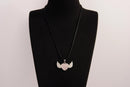 Raw Earth Crystals rose quartz heart with wings necklace, featuring a soft pink heart-shaped stone adorned with delicate angelic wings, designed to enhance love, compassion, and emotional healing.