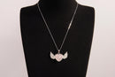 Raw Earth Crystals rose quartz heart with wings necklace, featuring a soft pink heart-shaped stone adorned with delicate angelic wings, designed to enhance love, compassion, and emotional healing.