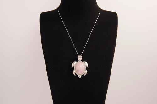 Raw Earth Crystals rose quartz turtle necklace made from natural crystal to open the heart, encourage self-love, and invite gentle emotional healing.