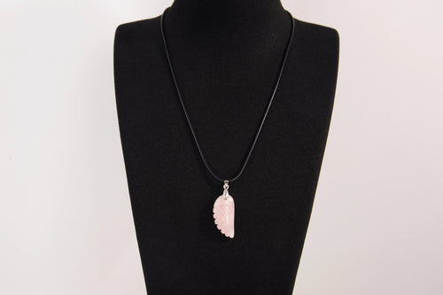 Raw Earth Crystals rose quartz pendant with an angel wing design, crafted from natural stone to encourage love, compassion, and emotional healing.
