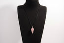 Raw Earth Crystals rose quartz pendant with a spiral wire wrap design, crafted from natural stone to foster love, compassion, and emotional healing.