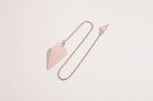 Raw Earth Crystals rose quartz pendulum with pointed crystal and silver chain, crafted for emotional balance, love, and clarity.