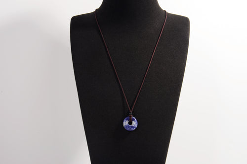 Raw Earth Crystals sodalite disc pendant necklace crafted from natural crystal for mental clarity, communication, and emotional balance.