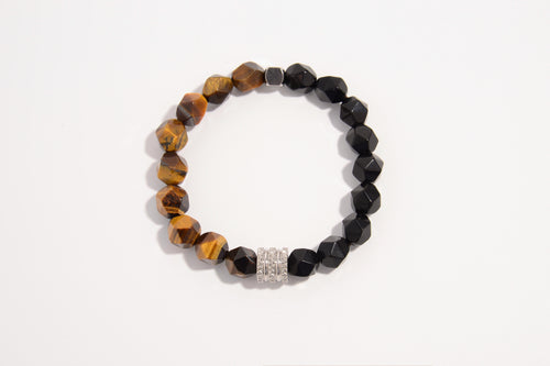 Raw Earth Crystals tiger eye and black onyx faceted bracelet with silver accent, crafted from natural crystals, enhances confidence, protection, and grounding.