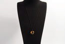Raw Earth Crystals tiger eye disc pendant necklace made with natural crystal for confidence, focus, and protection.