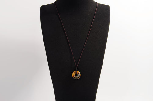 Raw Earth Crystals tiger eye disc pendant necklace made with natural crystal for confidence, focus, and protection.