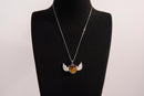 Raw Earth Crystals tiger eye heart with wings necklace, featuring a rich golden-brown heart-shaped stone adorned with delicate angelic wings, designed to enhance confidence, promote clarity, and support personal empowerment.
