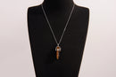 Raw Earth Crystals tiger eye necklace with a pointed natural stone pendant, designed to boost confidence, provide protection, and enhance mental clarity.