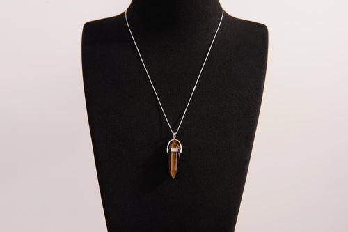 Raw Earth Crystals tiger eye necklace with a pointed natural stone pendant, designed to boost confidence, provide protection, and enhance mental clarity.