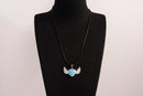 Raw Earth Crystals turquoise heart with wings necklace, featuring a vibrant blue-green heart-shaped stone adorned with delicate angelic wings, designed to promote communication, emotional balance, and spiritual protection.