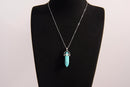 Raw Earth Crystals turquoise necklace featuring a pointed natural stone pendant, designed to promote communication, enhance intuition, and support emotional healing.