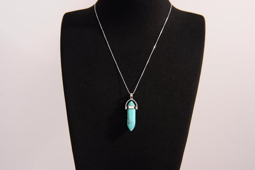 Raw Earth Crystals turquoise necklace featuring a pointed natural stone pendant, designed to promote communication, enhance intuition, and support emotional healing.