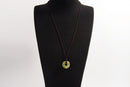 Raw Earth Crystals unakite donut pendant necklace, made from natural unakite to encourage emotional balance, compassion, and spiritual growth.