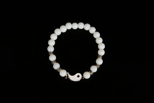 Raw Earth Crystals white jade bracelet with yin yang design, crafted from natural crystal, enhances clarity, peace, and emotional balance.