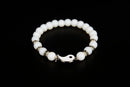 White jade beaded bracelet with yin yang charm from Raw Earth Crystals, featuring natural gemstones for balance, harmony, and spiritual alignment.