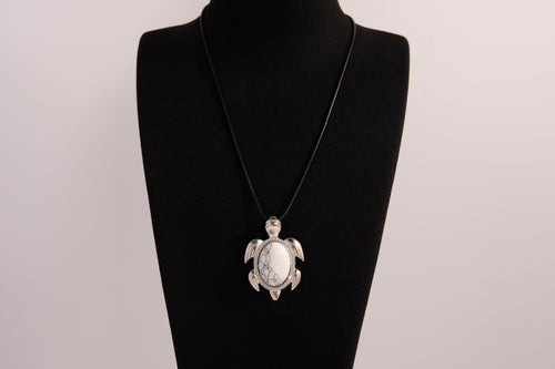 Raw Earth Crystals white turquoise turtle necklace crafted from natural stone to encourage calmness, clarity, and emotional healing.