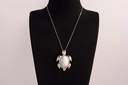 Raw Earth Crystals white turquoise turtle necklace crafted from natural stone to encourage calmness, clarity, and emotional healing.